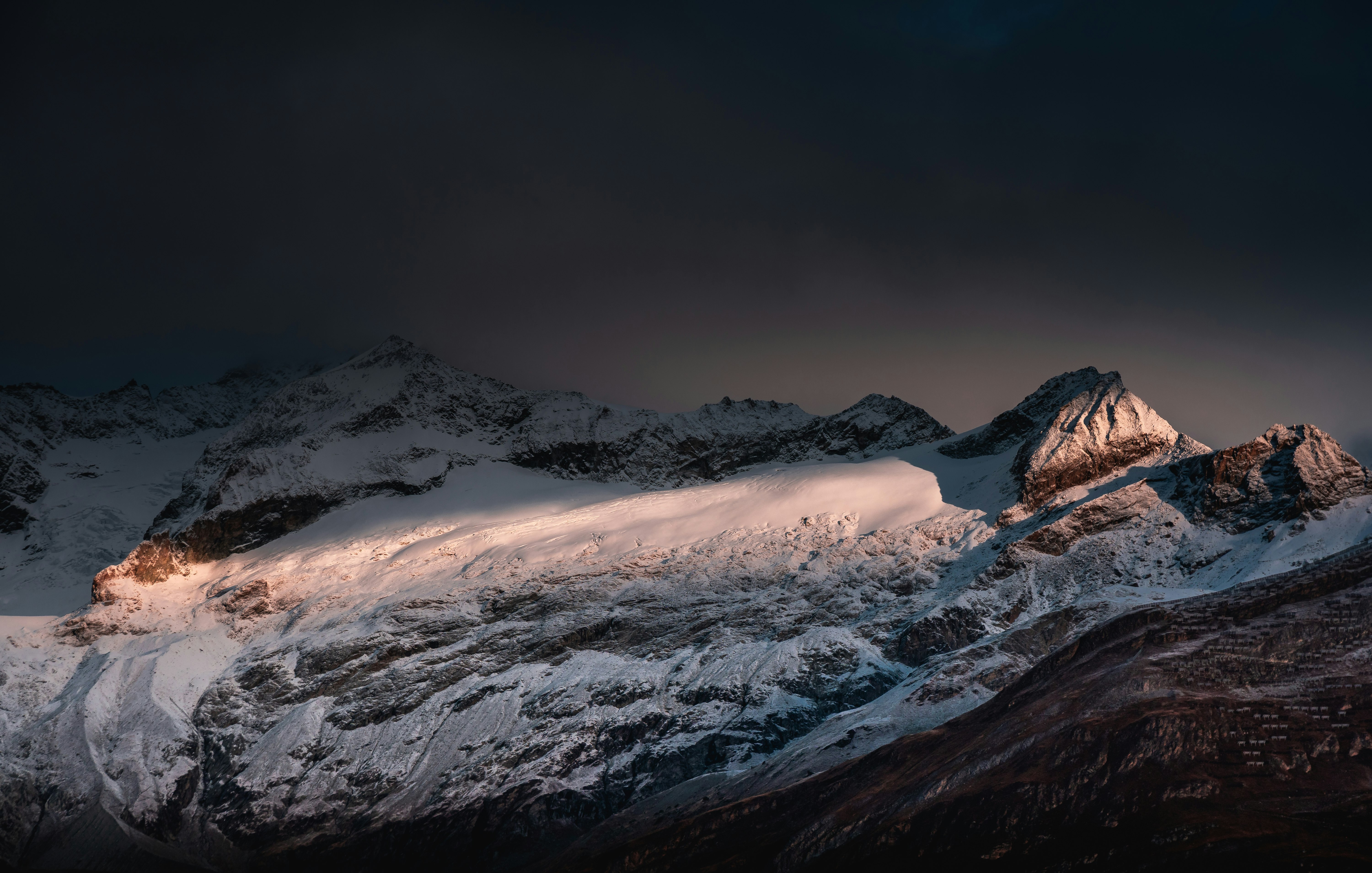 snow covered mountain during daytime